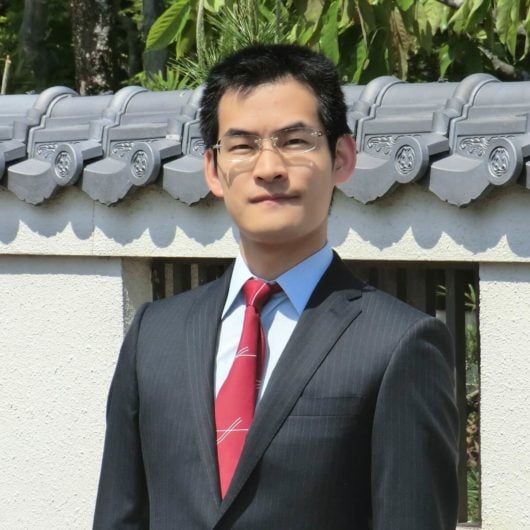 I am a monk wearing a suit.